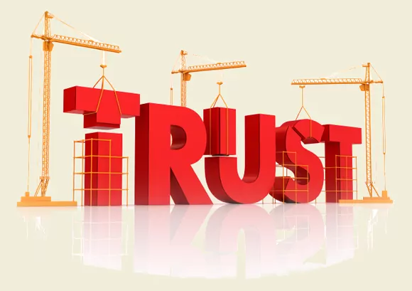 Graphic showing construction cranes assembling the word "Trust"